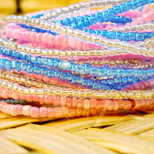 handmade African waistbeads in trans pride light pink, light blue, clear white waist beads