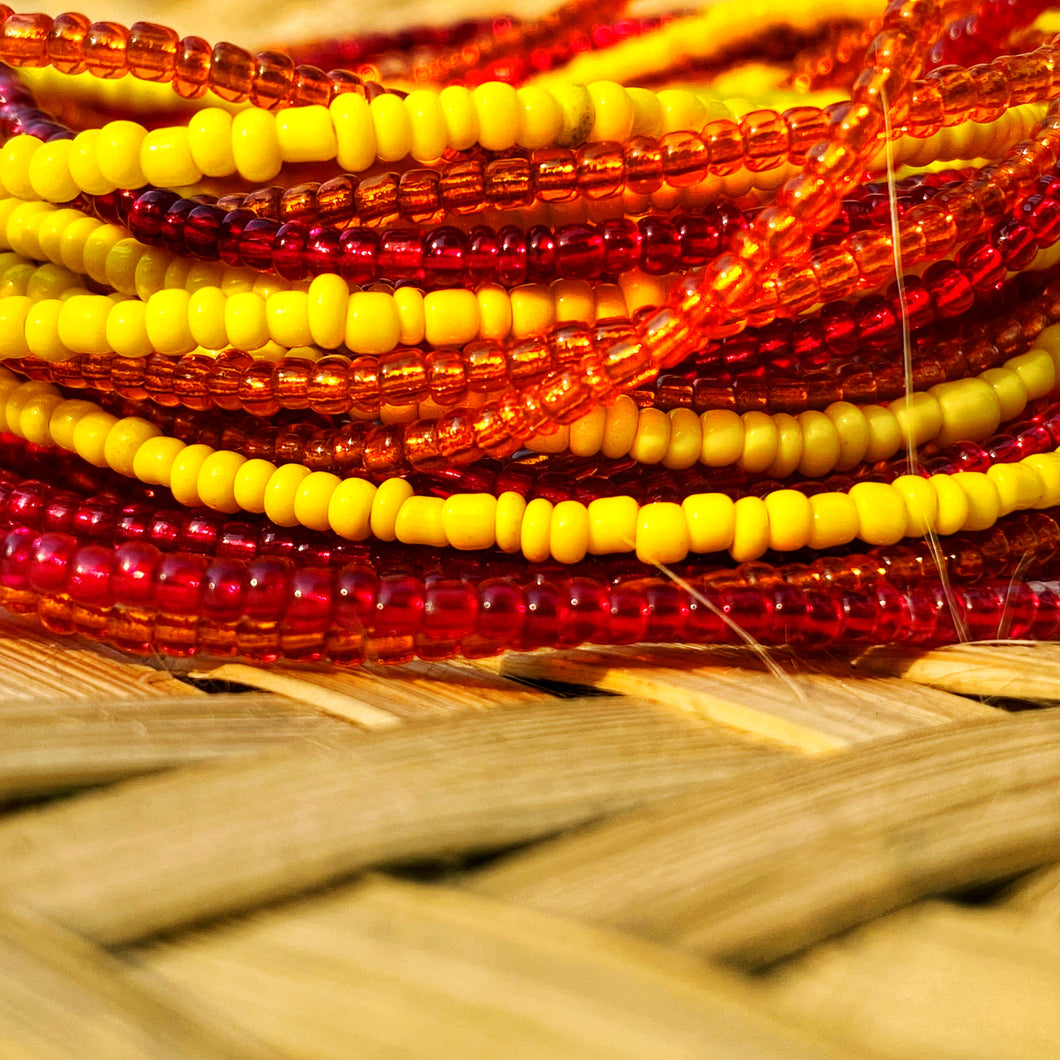 handmade african waist beads in red, yellow and orange